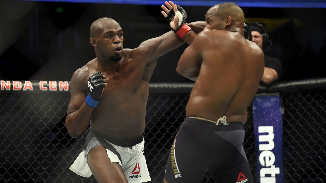 ANAHEIM, CA - JULY 29: (L-R) Jon Jones punches Daniel Cormier in their UFC light heavyweight championship bout during the UFC 214 event inside the Honda Center on July 29, 2017 in Anaheim, California.