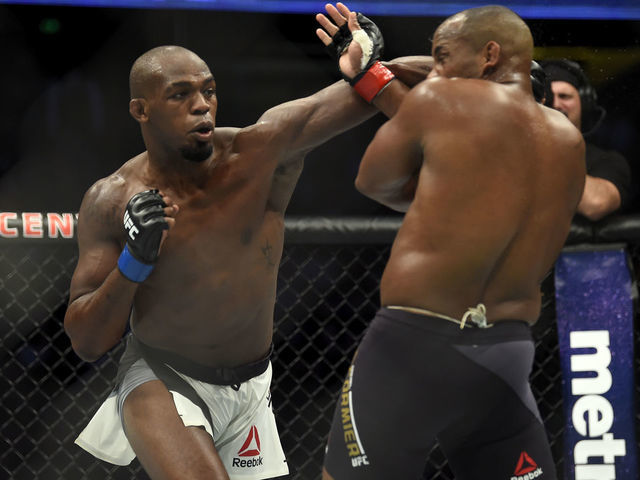 ANAHEIM, CA - JULY 29: (L-R) Jon Jones punches Daniel Cormier in their UFC light heavyweight championship bout during the UFC 214 event inside the Honda Center on July 29, 2017 in Anaheim, California.