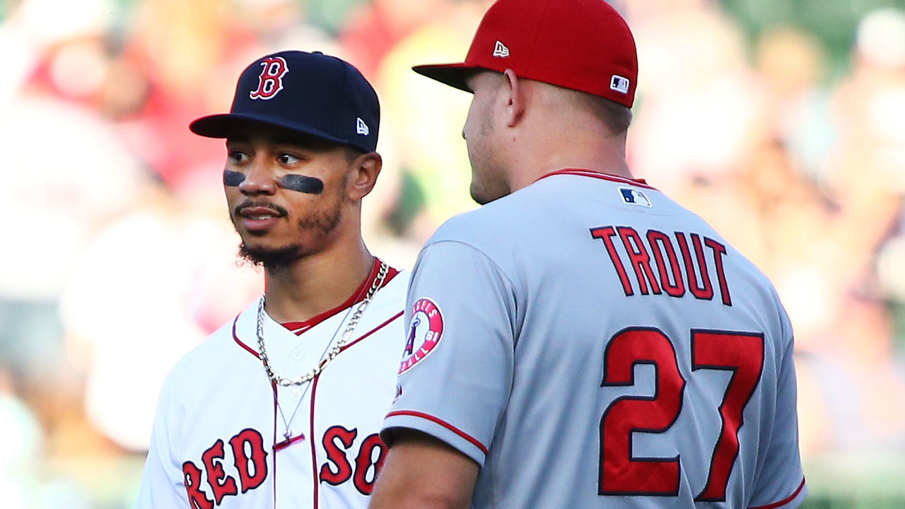 BOSTON, MA - JUNE 26: Mike Trout #27 of the Los Angeles Angels talks to Mookie Betts #50 of the Boston Red Sox before a game against the Boston Red Sox at Fenway Park on June 26, 2018 in Boston, Massachusetts.