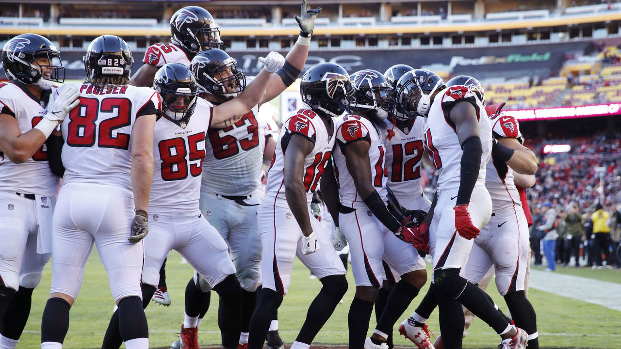 LANDOVER, MD - NOVEMBER 04: Julio Jones #11 of the Atlanta Falcons is mobbed by teammates after catching a 35-yard touchdown pass in the fourth quarter of the game against the Washington Redskins at FedExField on November 4, 2018 in Landover, Maryland. Atlanta won 38-14.