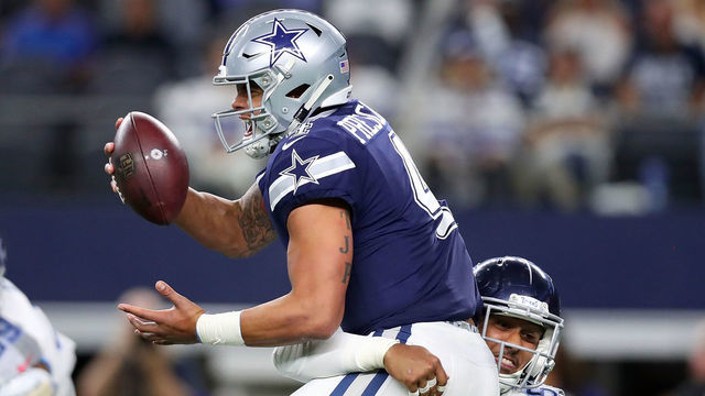 ARLINGTON, TX - NOVEMBER 05: Dak Prescott #4 of the Dallas Cowboys gets sacked by Harold Landry #58 of the Tennessee Titans in the fourth quarter of a football game at AT&T Stadium on November 5, 2018 in Arlington, Texas.