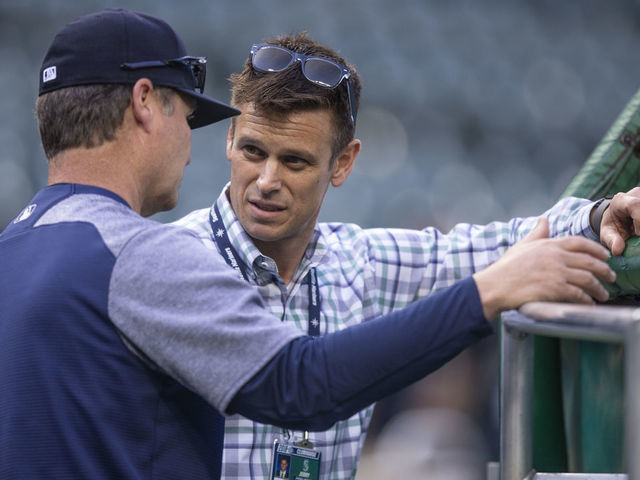 SEATTLE, WA - MAY 3: Seattle Mariners general manager Jerry Dipoto (R) talks with manager Scott Servais before a game between the Oakland Athletics and the Seattle Mariners at Safeco Field on May 3, 2018 in Seattle, Washington. The Mariners won the game 4-1.