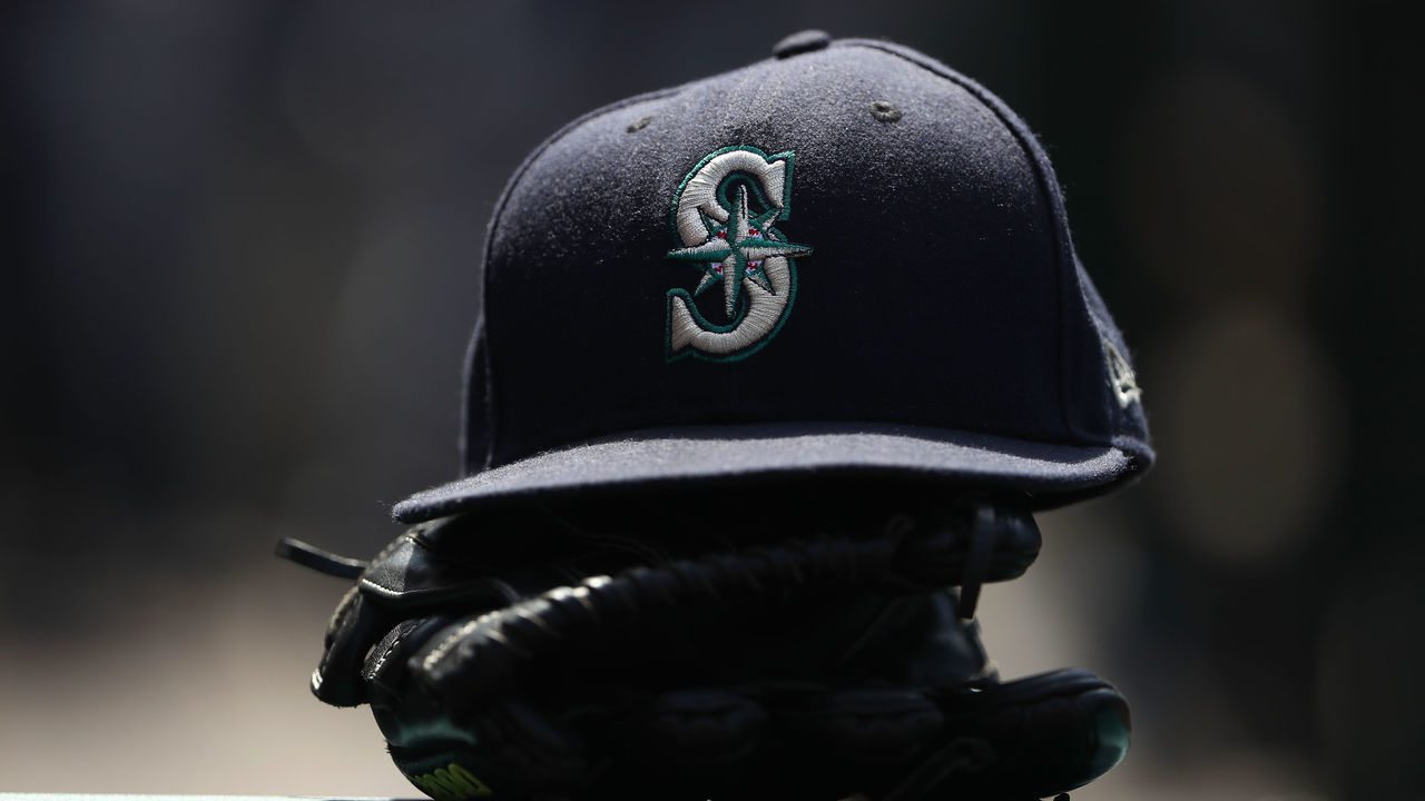 ANAHEIM, CA - JULY 29: A detailed view of a Seattle Mariners hat is seen on the dugout railing during the seventh inning of the MLB game between the Seattle Mariners and the Los Angeles Angels of Anaheim at Angel Stadium on July 29, 2018 in Anaheim, California. The Mariners defeated the Angels 8-5.