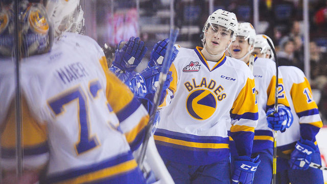 CALGARY, AB - OCTOBER 28:Kirby Dach #77 of the Saskatoon Blades celebrates with the bench after scoring against the Calgary Hitmen during a WHL game at the Scotiabank Saddledome on October 28, 2018 in Calgary, Alberta, Canada.
