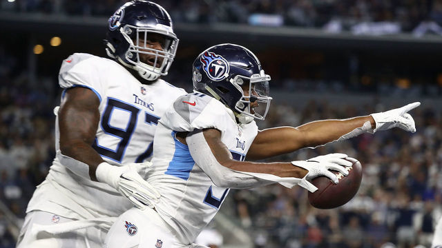 ARLINGTON, TX - NOVEMBER 05: Darius Kilgo #97 and Kevin Byard #31 of the Tennessee Titans celebrate the interception by Byard against the Dallas Cowboys in the first quarter of a football game at AT&T Stadium on November 5, 2018 in Arlington, Texas.