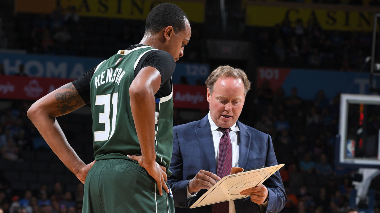 OKLAHOMA CITY, OK - OCTOBER 9: John Henson #31 and Head Coach Mike Budenholzer of the Milwaukee Bucks review a play against the Oklahoma City Thunder during a pre-season game on October 9, 2018 at Chesapeake Energy Arena in Oklahoma City, Oklahoma. NOTE TO USER: User expressly acknowledges and agrees that, by downloading and/or using this photograph, user is consenting to the terms and conditions of the Getty Images License Agreement. Mandatory Copyright Notice: Copyright 2018 NBAE