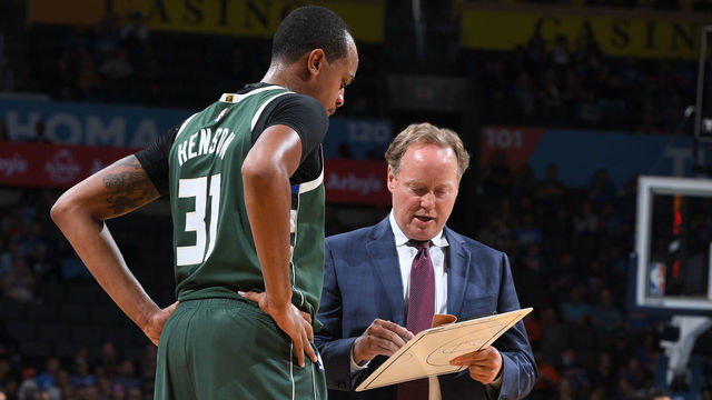 OKLAHOMA CITY, OK - OCTOBER 9: John Henson #31 and Head Coach Mike Budenholzer of the Milwaukee Bucks review a play against the Oklahoma City Thunder during a pre-season game on October 9, 2018 at Chesapeake Energy Arena in Oklahoma City, Oklahoma. NOTE TO USER: User expressly acknowledges and agrees that, by downloading and/or using this photograph, user is consenting to the terms and conditions of the Getty Images License Agreement. Mandatory Copyright Notice: Copyright 2018 NBAE