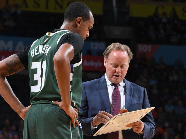 OKLAHOMA CITY, OK - OCTOBER 9: John Henson #31 and Head Coach Mike Budenholzer of the Milwaukee Bucks review a play against the Oklahoma City Thunder during a pre-season game on October 9, 2018 at Chesapeake Energy Arena in Oklahoma City, Oklahoma. NOTE TO USER: User expressly acknowledges and agrees that, by downloading and/or using this photograph, user is consenting to the terms and conditions of the Getty Images License Agreement. Mandatory Copyright Notice: Copyright 2018 NBAE