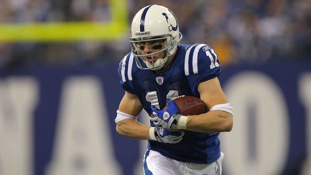 INDIANAPOLIS - JANUARY 13: Anthony Gonzalez #11 of the Indianapolis Colts runs for yards after the catch against the San Diego Chargers during their AFC Divisional Playoff game at the RCA Dome on January 13, 2008 in Indianapolis, Indiana. The Chargers won 28-24.