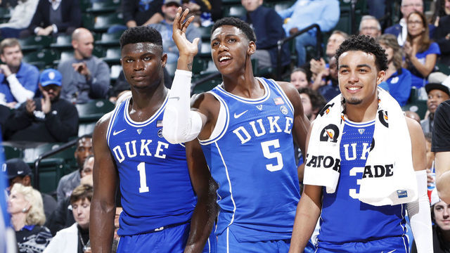 INDIANAPOLIS, IN - NOVEMBER 06: Zion Williamson #1, RJ Barrett #5 and Tre Jones #3 of the Duke Blue Devils react from the bench during the State Farm Champions Classic against the Kentucky Wildcats at Bankers Life Fieldhouse on November 6, 2018 in Indianapolis, Indiana. Duke defeated Kentucky 118-84.