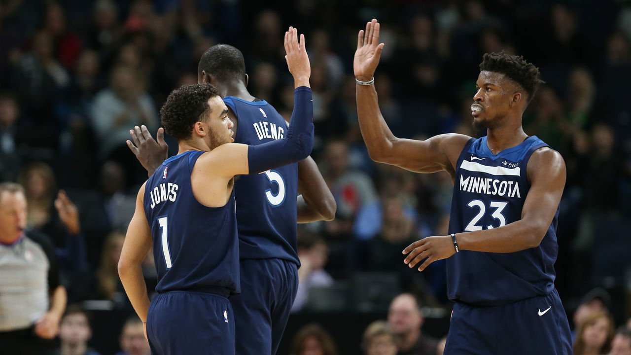 MINNEAPOLIS, MN - DECEMBER 3: Tyus Jones #1 of the Minnesota Timberwolves and Jimmy Butler #23 of the Minnesota Timberwolves high five during the game against the LA Clippers on December 3, 2017 at Target Center in Minneapolis, Minnesota. Mandatory Copyright Notice: Copyright 2017 NBAE