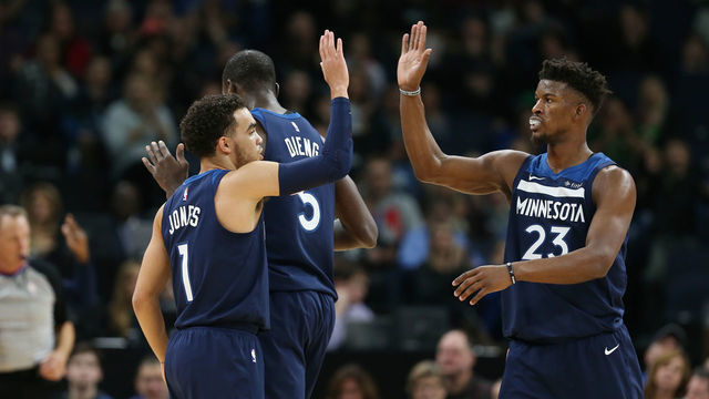 MINNEAPOLIS, MN - DECEMBER 3: Tyus Jones #1 of the Minnesota Timberwolves and Jimmy Butler #23 of the Minnesota Timberwolves high five during the game against the LA Clippers on December 3, 2017 at Target Center in Minneapolis, Minnesota. Mandatory Copyright Notice: Copyright 2017 NBAE
