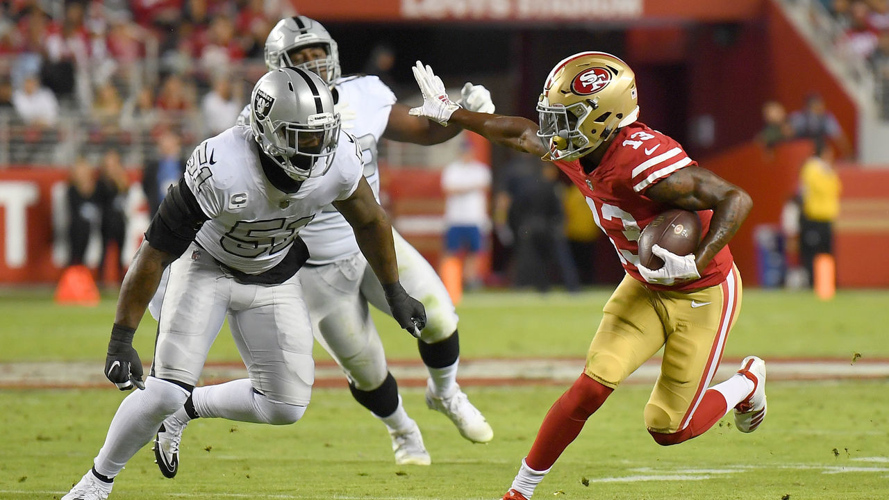 SANTA CLARA, CA - NOVEMBER 01: Richie James #13 of the San Francisco 49ers fights off the tackle of Bruce Irvin #51 of the Oakland Raiders during their NFL football game at Levi's Stadium on November 1, 2018 in Santa Clara, California.