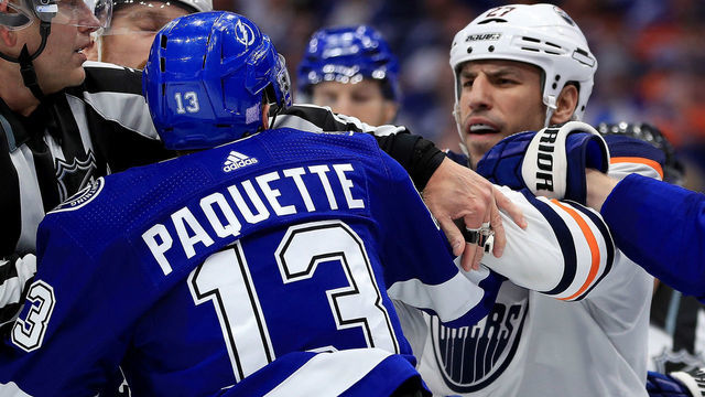 TAMPA, FL - NOVEMBER 06: Cedric Paquette #13 of the Tampa Bay Lightning and Milan Lucic #27 of the Edmonton Oilers exchange words during a game at Amalie Arena on November 6, 2018 in Tampa, Florida.