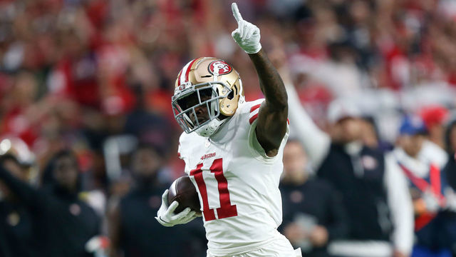 GLENDALE, AZ - OCTOBER 28: Marquise Goodwin #11 of the San Francisco 49ers runs to the end zone on a 55-yard touchdown reception during the game against the Arizona Cardinals at State Farm Stadium on October 28, 2018 in Glendale, Arizona. The Cardinals defeated the 49ers 18-15.