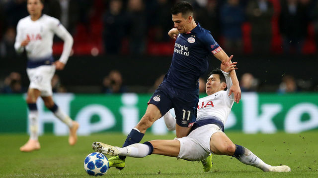 LONDON, ENGLAND - NOVEMBER 06: Hirving Lozano of PSV Eindhoven is tackled by Heung-Min Son of Tottenham Hotspur during the Group B match of the UEFA Champions League between Tottenham Hotspur and PSV at Wembley Stadium on November 6, 2018 in London, United Kingdom.