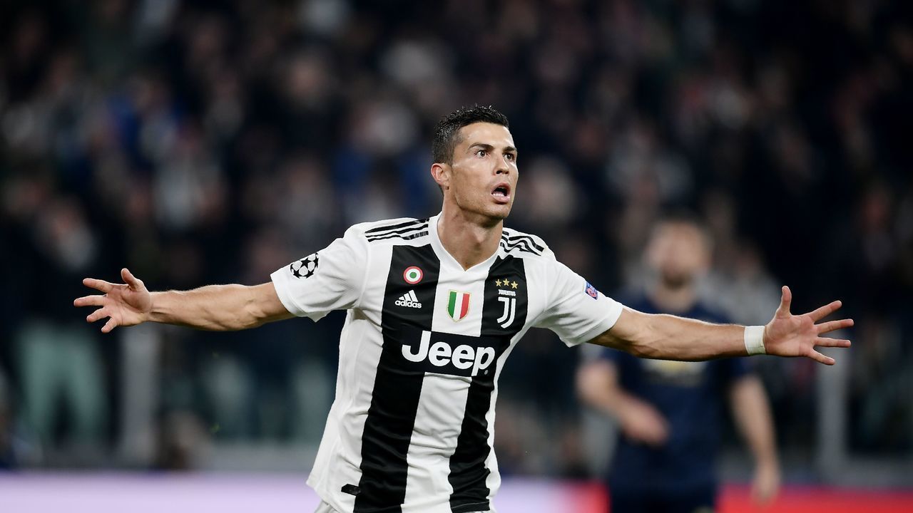 Juventus' Portuguese forward Cristiano Ronaldo celebrates after opening the scoring during the UEFA Champions League group H football match Juventus vs Manchester United at the Allianz stadium in Turin on November 7, 2018.