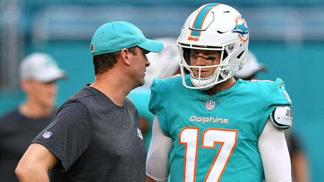 MIAMI, FL - AUGUST 09: Ryan Tannehill #17 of the Miami Dolphins speaks with head coach Adam Gase during warmups before a preseason game against the Tampa Bay Buccaneers at Hard Rock Stadium on August 9, 2018 in Miami, Florida.