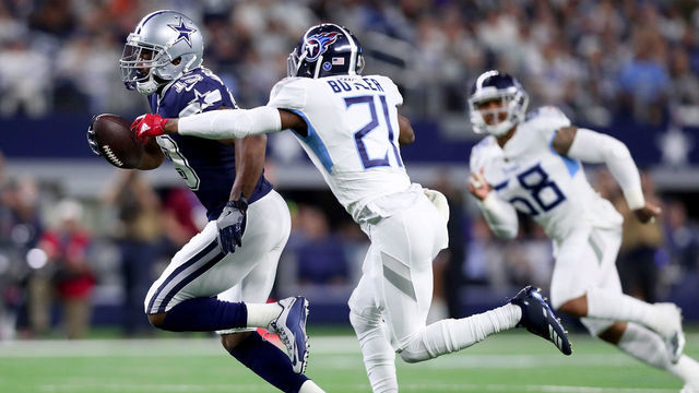 ARLINGTON, TX - NOVEMBER 05: Amari Cooper #19 of the Dallas Cowboys carries the ball against Malcolm Butler #21 of the Tennessee Titans in the second quarter at AT&T Stadium on November 5, 2018 in Arlington, Texas.