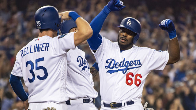 LOS ANGELES, CA - OCTOBER 27: Yasiel Puig #66 of the Los Angeles Dodgers reacts with Cody Bellinger #35 after hitting a three run home run during the sixth inning of game four of the 2018 World Series against the Boston Red Sox on October 27, 2018 at Dodger Stadium in Los Angeles, California.