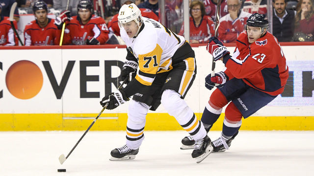 WASHINGTON, DC - NOVEMBER 07: Pittsburgh Penguins center Evgeni Malkin (71) skate in the first period against Washington Capitals right wing Dmitrij Jaskin (23) on November 7, 2018, at the Capital One Arena in Washington, D.C. The Washington Capitals defeated the Pittsburgh Penguins, 2-1.