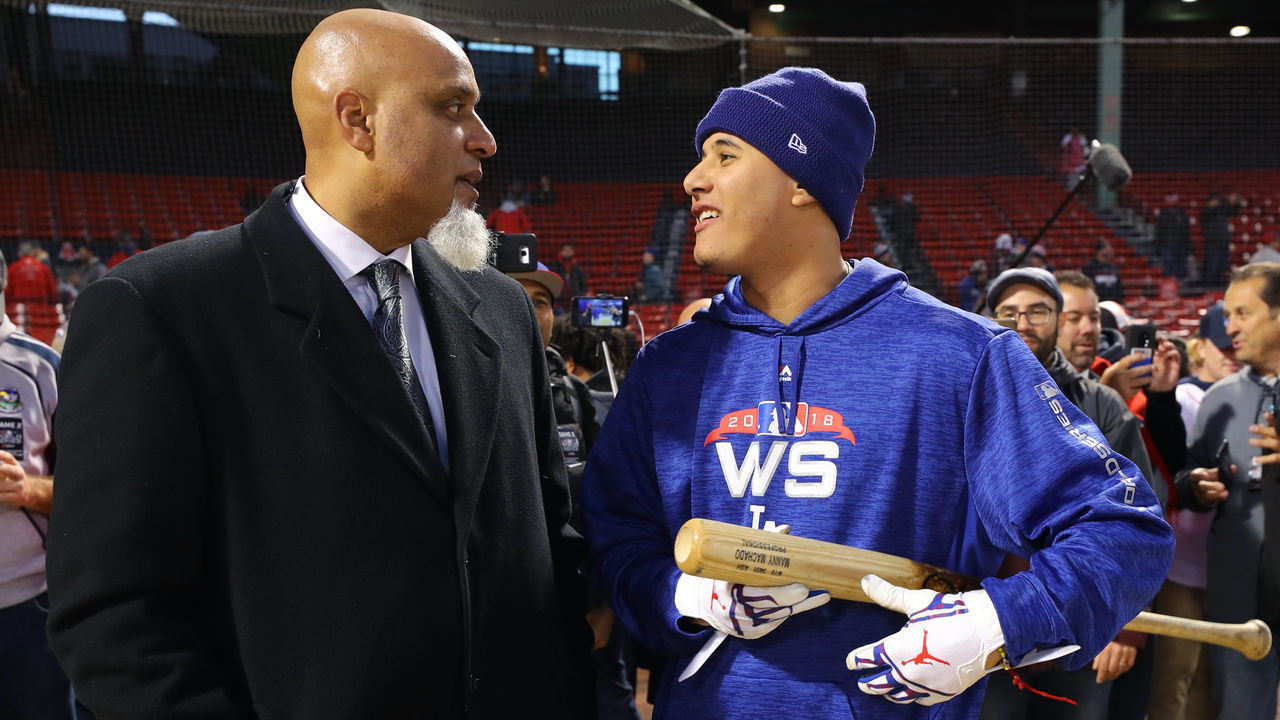 BOSTON, MA - OCTOBER 24: Tony Clark and Manny Machado #8 of the Los Angeles Dodgers talk during batting practice prior to Game 2 of the 2018 World Series between the Los Angeles Dodgers and the Boston Red Sox at Fenway Park on Wednesday, October 24, 2018 in Boston, Massachusetts.