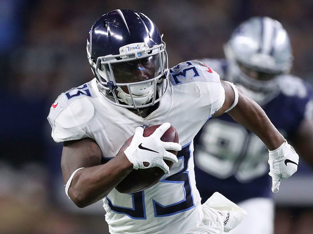 ARLINGTON, TX - NOVEMBER 05: Dion Lewis #33 of the Tennessee Titans carries the ball on a touchdown run in the second quarter of a football game at AT&T Stadium on November 5, 2018 in Arlington, Texas.