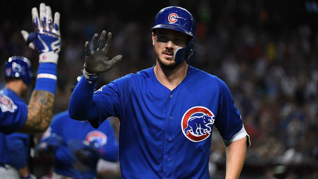 PHOENIX, AZ - SEPTEMBER 17: Kris Bryant #17 of the Chicago Cubs celebrates with teammates after hitting a home run against the Arizona Diamondbacks at Chase Field on September 17, 2018 in Phoenix, Arizona.