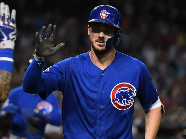 PHOENIX, AZ - SEPTEMBER 17: Kris Bryant #17 of the Chicago Cubs celebrates with teammates after hitting a home run against the Arizona Diamondbacks at Chase Field on September 17, 2018 in Phoenix, Arizona.