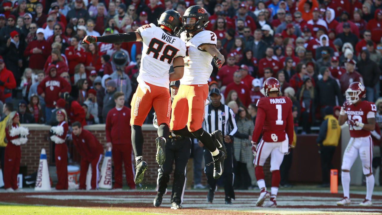 NORMAN, OK - NOVEMBER 10: Wide receiver Landon Wolf #88 and wide receiver Tylan Wallace #2 of the Oklahoma State Cowboys celebrate touchdown against the Oklahoma Sooners at Gaylord Family Oklahoma Memorial Stadium on November 10, 2018 in Norman, Oklahoma.