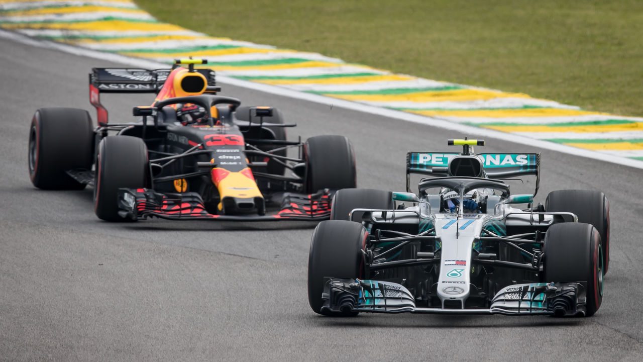 SAO PAULO, BRAZIL - NOVEMBER 11: Valtteri Bottas driving the (77) Mercedes AMG Petronas F1 Team Mercedes WO9 leads Max Verstappen of the Netherlands driving the (33) Aston Martin Red Bull Racing RB14 TAG Heuer on track during the Formula One Grand Prix of Brazil at Autodromo Jose Carlos Pace on November 11, 2018 in Sao Paulo, Brazil.