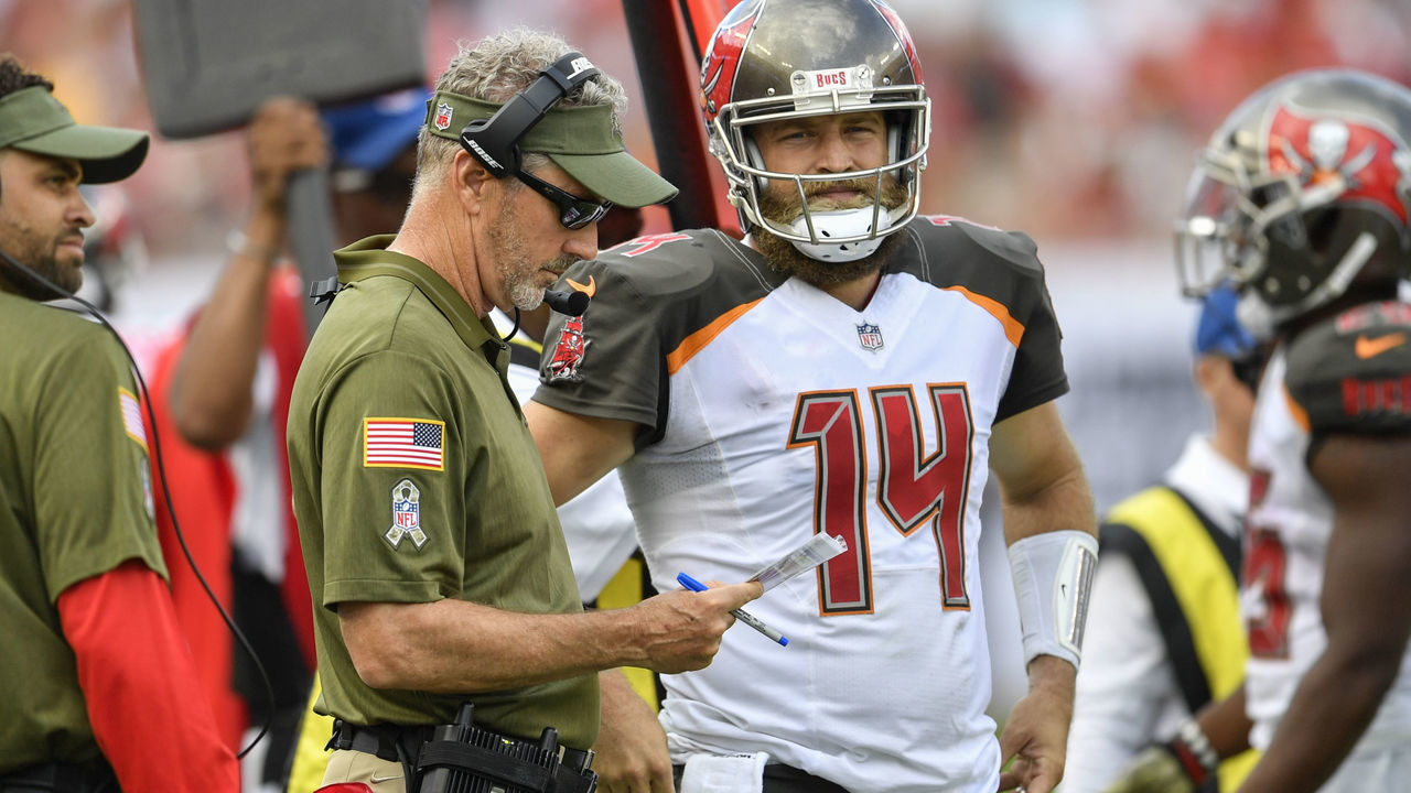 TAMPA, FL - NOVEMBER 11: Tampa Bay Buccaneers head coach Dirk Koetter and Tampa Bay Buccaneers quarterback Ryan Fitzpatrick (14) discuss the plays prior to taking the field on offense during the second half of an NFL game between the Washington Redskins and the Tampa Bay Bucs on November 11, 2018, at Raymond James Stadium in Tampa, FL.