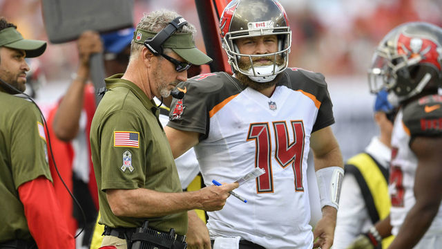 TAMPA, FL - NOVEMBER 11: Tampa Bay Buccaneers head coach Dirk Koetter and Tampa Bay Buccaneers quarterback Ryan Fitzpatrick (14) discuss the plays prior to taking the field on offense during the second half of an NFL game between the Washington Redskins and the Tampa Bay Bucs on November 11, 2018, at Raymond James Stadium in Tampa, FL.