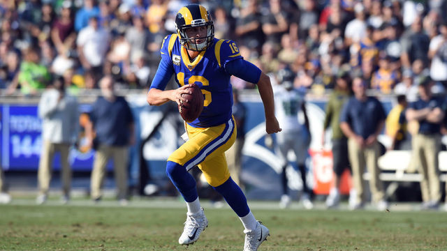 Los Angeles Rams Quarterback Jared Goff (16) rolls out of the pocket during an NFL game between the Seattle Seahawks and the Los Angeles Rams on November 11, 2018, at the Los Angeles Memorial Coliseum in Los Angeles, CA.