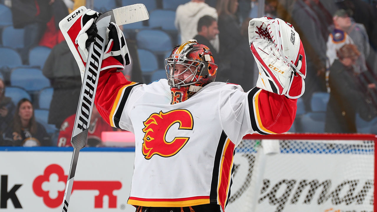 BUFFALO, NY - OCTOBER 30: David Rittich #33 of the Calgary Flames celebrates after their 2-1 overtime victory against the Buffalo Sabres in an NHL game on October 30, 2018 at KeyBank Center in Buffalo, New York. Calgary won, 2-1, in overtime.