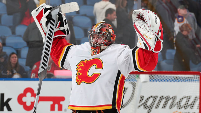 BUFFALO, NY - OCTOBER 30: David Rittich #33 of the Calgary Flames celebrates after their 2-1 overtime victory against the Buffalo Sabres in an NHL game on October 30, 2018 at KeyBank Center in Buffalo, New York. Calgary won, 2-1, in overtime.