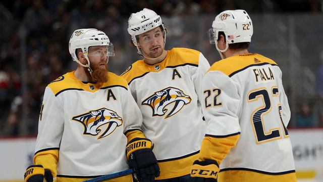 DENVER, CO - NOVEMBER 07: Ryan Ellis #4, Fillip Forsberg #9 and Kevin Fiala #22 of the Nashville Predators confer while playing the Colorado Avalanche at the Pepsi Center on November 7, 2018 in Denver, Colorado.