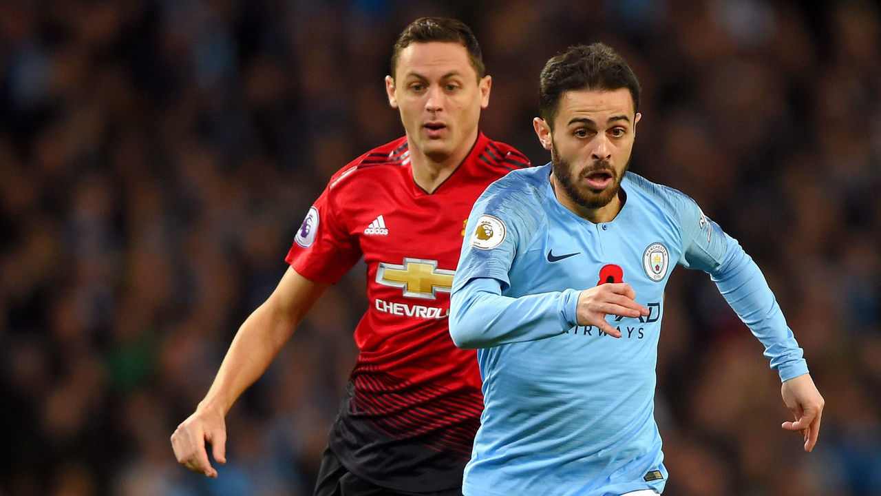 MANCHESTER, ENGLAND - NOVEMBER 11: Bernardo Silva of Manchester City takes the ball away from Nemanja Matic of Manchester United during the Premier League match between Manchester City and Manchester United at Etihad Stadium on November 11, 2018 in Manchester, United Kingdom.