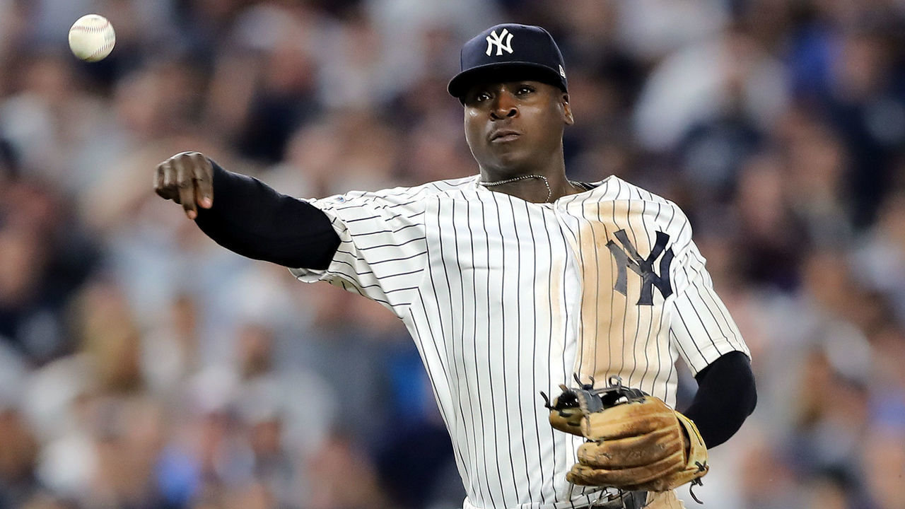 NEW YORK, NEW YORK - OCTOBER 09: Didi Gregorius #18 of the New York Yankees throws to first base against the Boston Red Sox during Game Four American League Division Series at Yankee Stadium on October 09, 2018 in the Bronx borough of New York City.