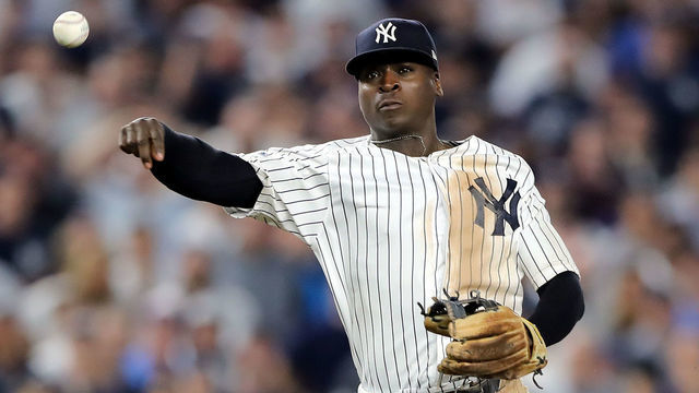 NEW YORK, NEW YORK - OCTOBER 09: Didi Gregorius #18 of the New York Yankees throws to first base against the Boston Red Sox during Game Four American League Division Series at Yankee Stadium on October 09, 2018 in the Bronx borough of New York City.