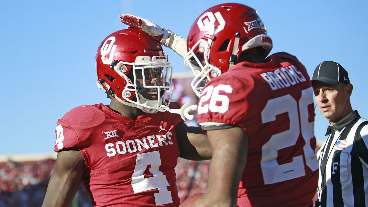 NORMAN, OK - NOVEMBER 10: Running back Trey Sermon #4 congratulates running back Kennedy Brooks #26 of the Oklahoma Sooners on a score against the Oklahoma State Cowboys at Gaylord Family Oklahoma Memorial Stadium on November 10, 2018 in Norman, Oklahoma. Oklahoma defeated Oklahoma State 48-47.