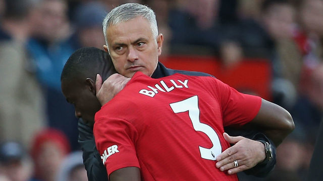 MANCHESTER, ENGLAND - OCTOBER 06: Manager Jose Mourinho of Manchester United consoles Eric Bailly after substituting him during the Premier League match between Manchester United and Newcastle United at Old Trafford on October 6, 2018 in Manchester, United Kingdom.