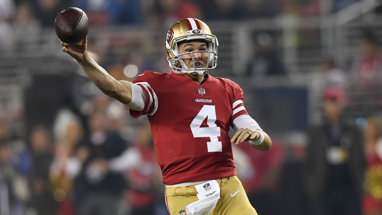 SANTA CLARA, CA - NOVEMBER 12: Nick Mullens #4 of the San Francisco 49ers throws the ball under pressure from Lorenzo Carter #59 of the New York Giants during their NFL game at Levi's Stadium on November 12, 2018 in Santa Clara, California.