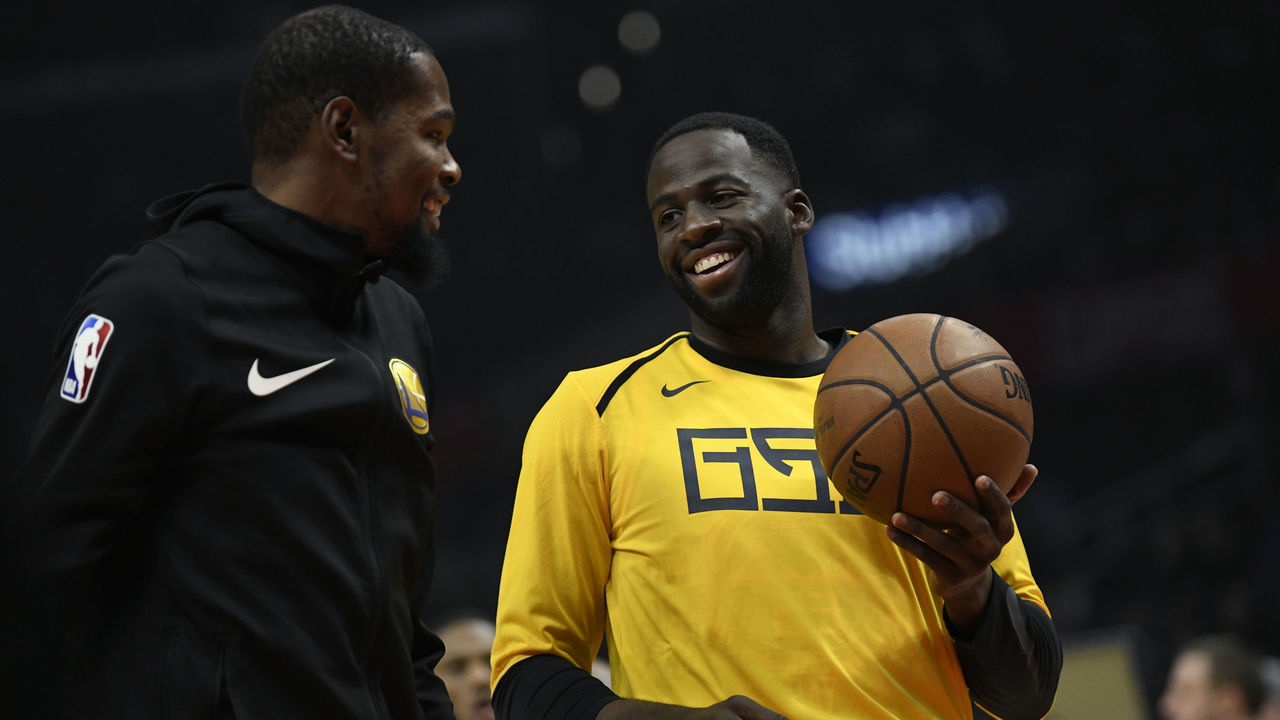 LOS ANGELES, CA - NOVEMBER 12: Kevin Durant #35 of the Golden State Warriors talks to his teamate Draymond Green during warm up before the game against the Los Angeles Clippers on November 12, 2018 at STAPLES Center in Los Angeles, California.