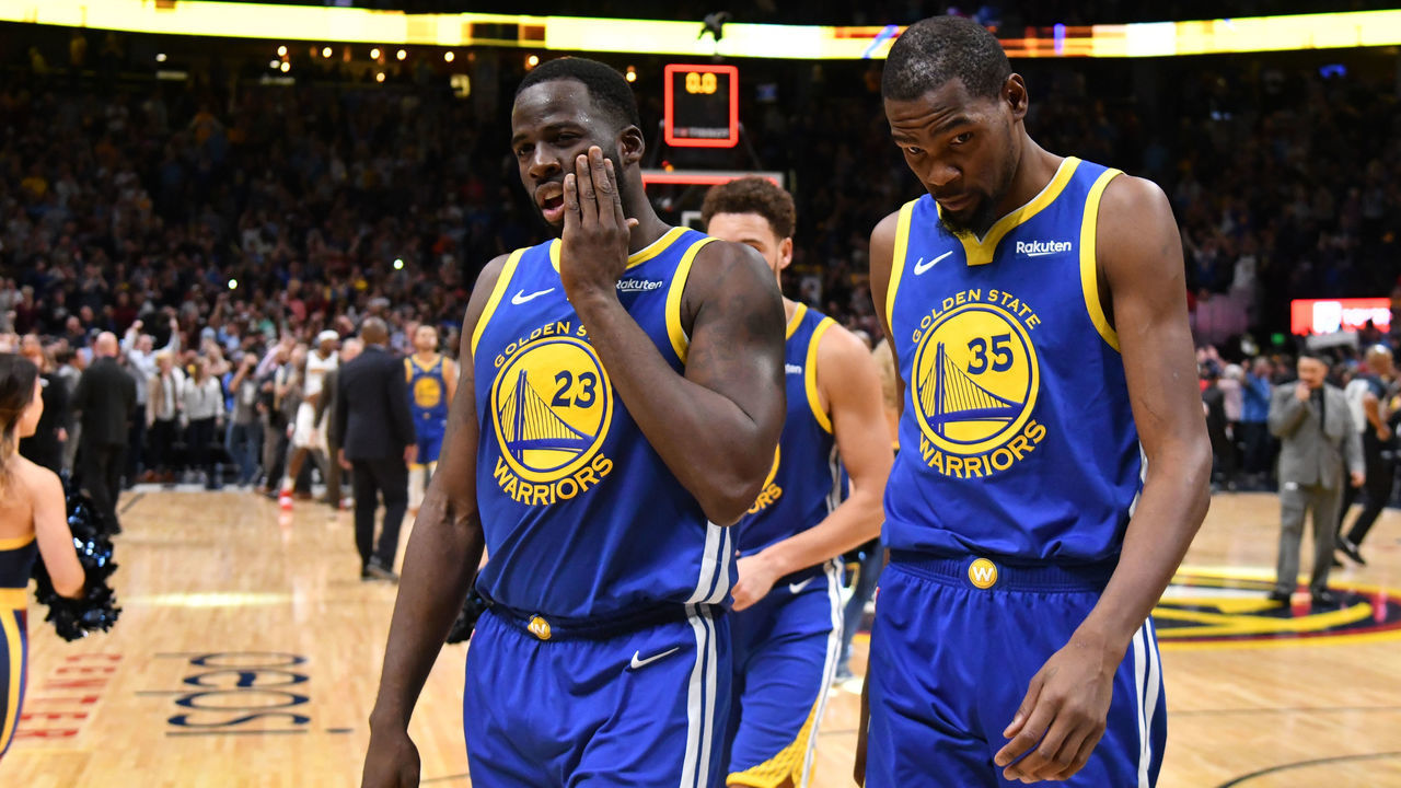 DENVER, CO - OCTOBER 21: Draymond Green #23 and Kevin Durant #35 of the Golden State Warriors walk off the court after losing to the Denver Nuggets at Pepsi Center on October 21, 2018 in Denver, Colorado. The Denver Nuggets defeated the Golden State Warriors 100-98.