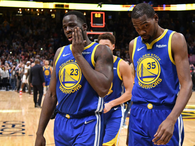 DENVER, CO - OCTOBER 21: Draymond Green #23 and Kevin Durant #35 of the Golden State Warriors walk off the court after losing to the Denver Nuggets at Pepsi Center on October 21, 2018 in Denver, Colorado. The Denver Nuggets defeated the Golden State Warriors 100-98.