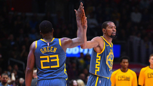 LOS ANGELES, CA - NOVEMBER 12: Golden State Warriors Forward Draymond Green (23) gives Golden State Warriors Forward Kevin Durant (35) a high five during a NBA game between the Golden State Warriors and the Los Angeles Clippers on November 12, 2018 at STAPLES Center in Los Angeles, CA.