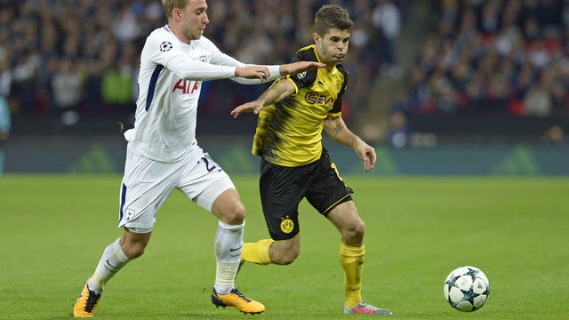 LONDON, ENGLAND - SEPTEMBER 13: Christian Eriksen of Tottenham and Christian Pulisic of Dortmund battle for the ball during the UEFA Champions League group H match between Tottenham Hotspur and Borussia Dortmund at Wembley Stadium on September 13, 2017 in London, United Kingdom.