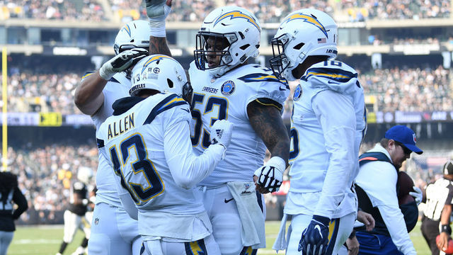 OAKLAND, CA - NOVEMBER 11: Keenan Allen #13 of the Los Angeles Chargers celebrates after an 11-yard touchdown against the Oakland Raiders during their NFL game at Oakland-Alameda County Coliseum on November 11, 2018 in Oakland, California.