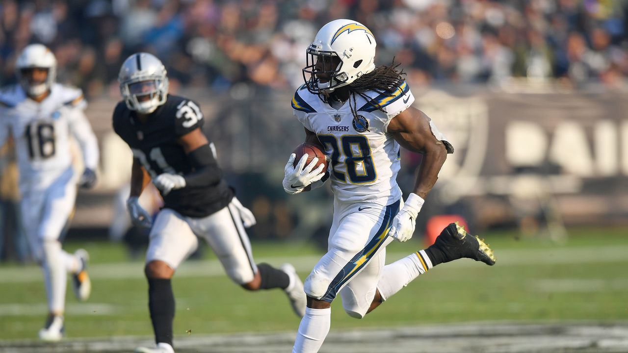OAKLAND, CA - NOVEMBER 11: Melvin Gordon #28 of the Los Angeles Chargers runs for a 66-yard touchdown against the Oakland Raiders during their NFL game at Oakland-Alameda County Coliseum on November 11, 2018 in Oakland, California.